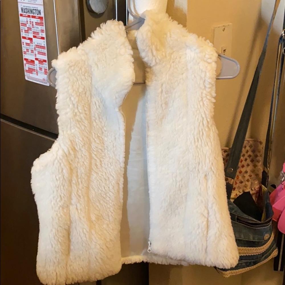 White fuzzy vest